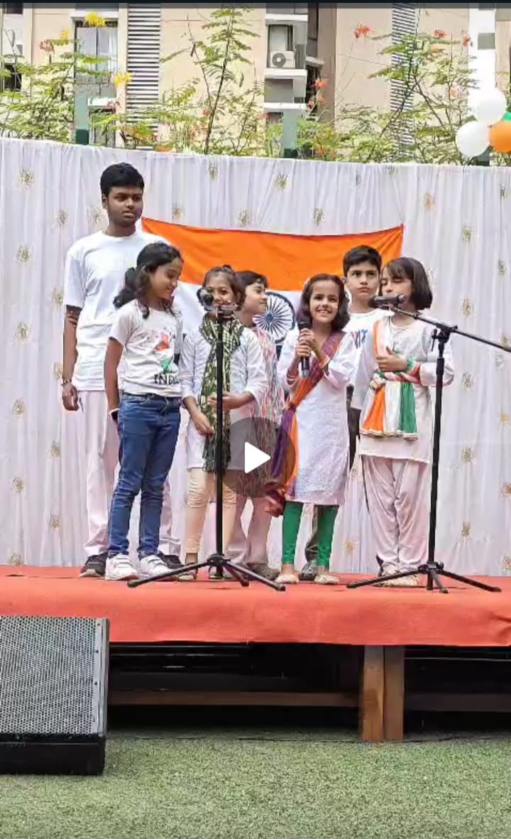 Students singing on stage on Independence Day